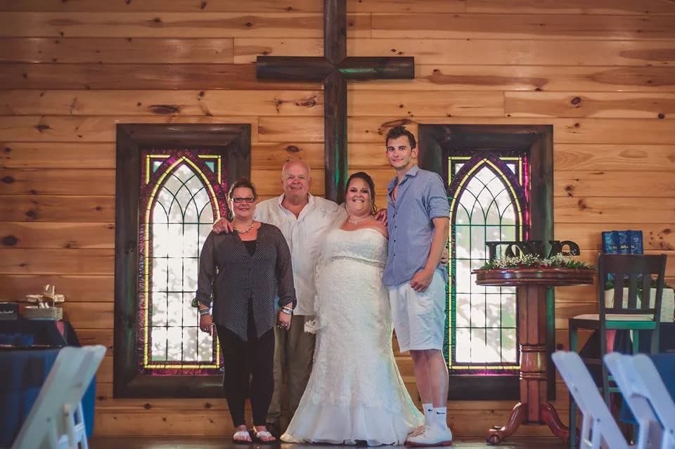 Rustic chapel wedding ceremony space with wooden cross at Moose Hollow Lodge in Pigeon Forge