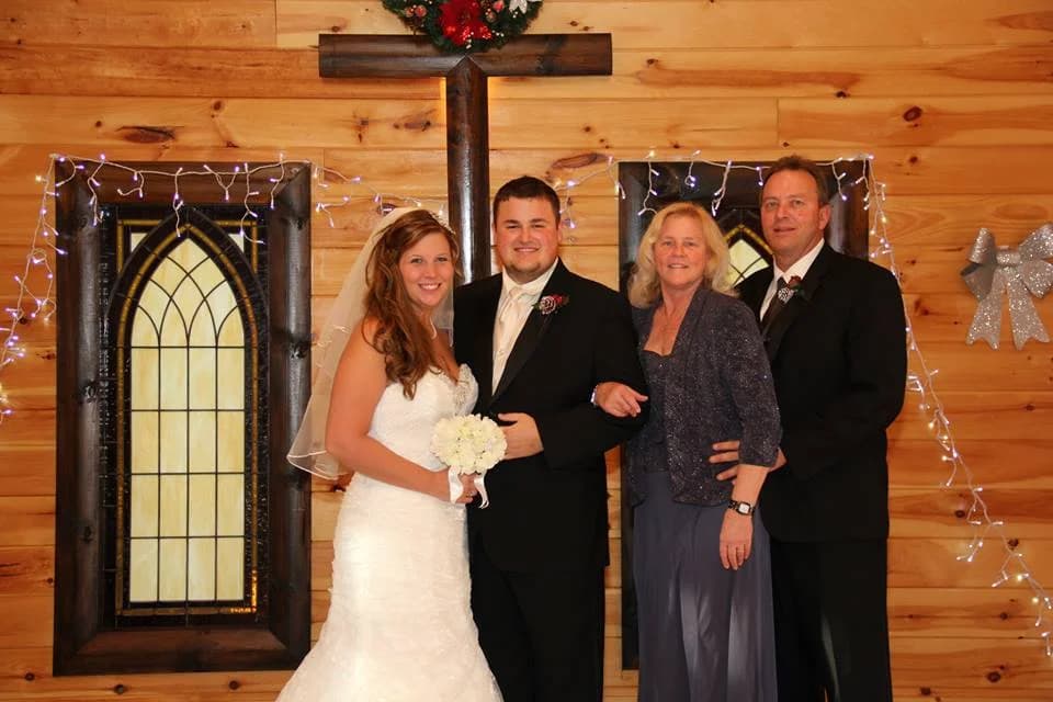 Wedding chapel interior with wood cross and stained glass windows at Moose Hollow Lodge in Pigeon Forge