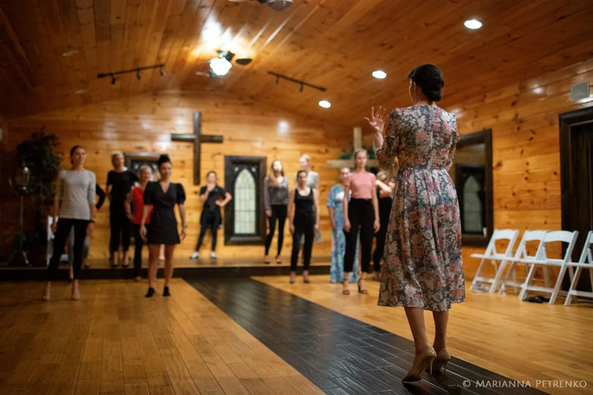 Spacious rustic wedding chapel with wood walls and stage at Moose Hollow Lodge in Pigeon Forge