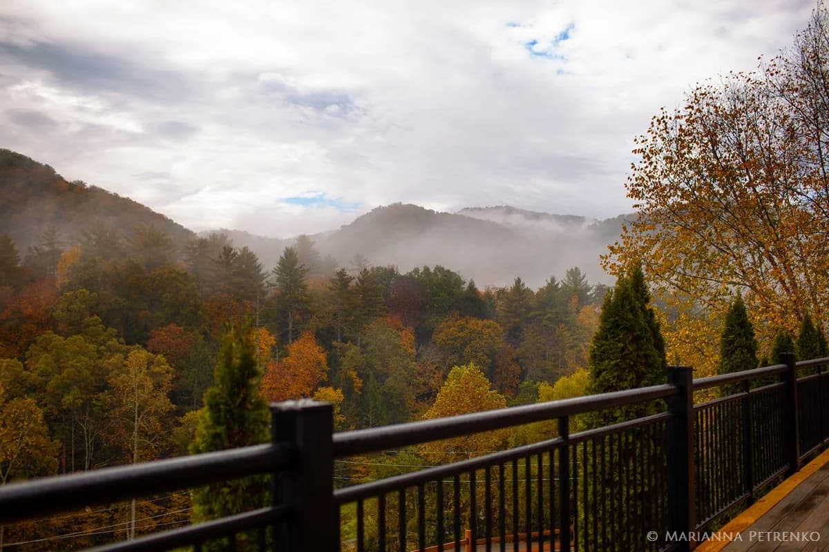 Misty Smoky Mountains views and autumn foliage from the deck at Moose Hollow Lodge in Pigeon Forge near Dollywood