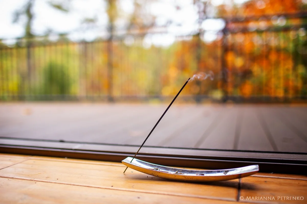 Burning incense stick on a deck with Smoky Mountain views at Moose Hollow Lodge in Pigeon Forge near Dollywood
