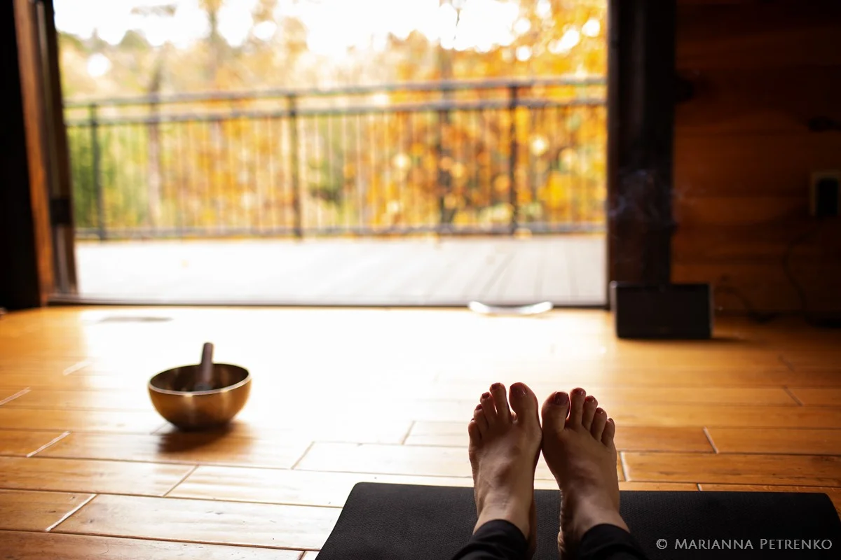 Yoga mat and singing bowl with autumn forest views at Moose Hollow Lodge in Pigeon Forge near Dollywood