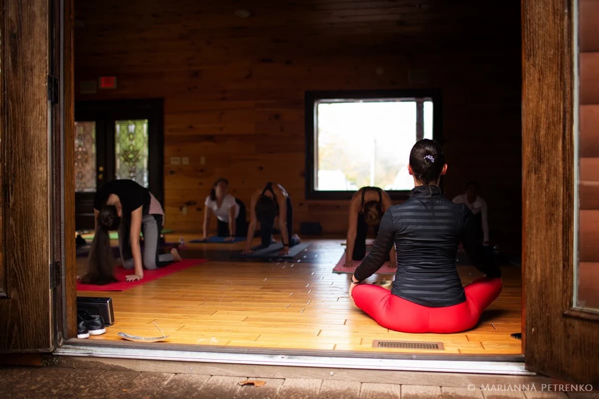 Yoga session in a rustic wood-paneled event space at Moose Hollow Lodge in Pigeon Forge