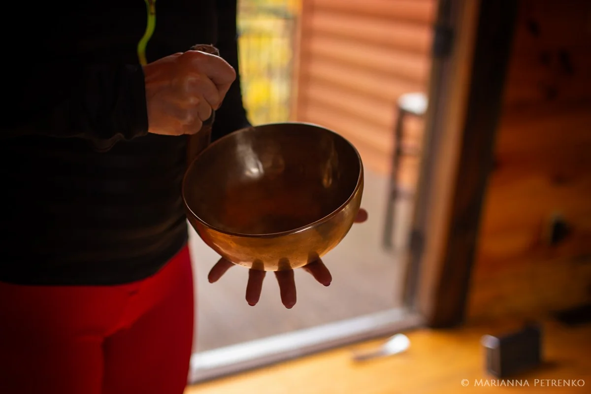 Brass singing bowl for meditation inside a rustic cabin at Moose Hollow Lodge in Pigeon Forge