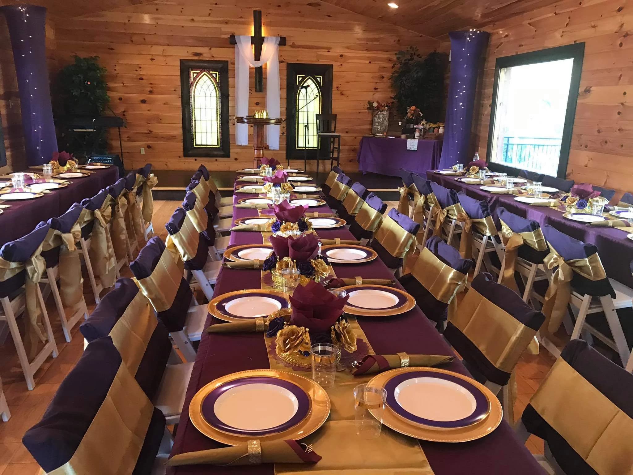 Rustic wooden chapel with elegant purple and gold banquet setup at Moose Hollow Lodge in Pigeon Forge