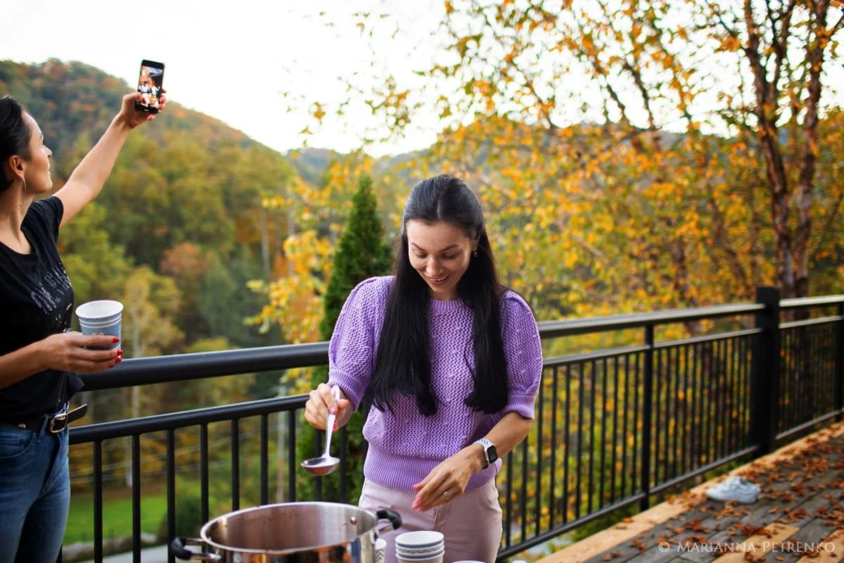Serving food on a deck with autumn Smoky Mountains views at Moose Hollow Lodge in Pigeon Forge near Dollywood