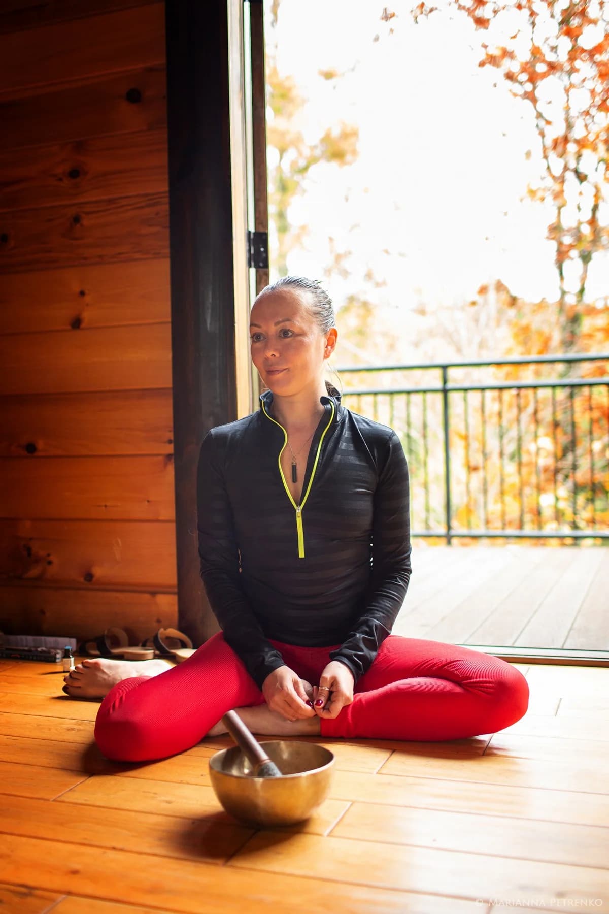 Meditation with singing bowl in rustic cabin with forest views at Moose Hollow Lodge in Pigeon Forge