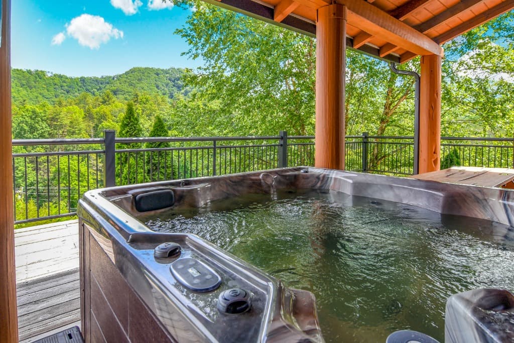 Private hot tub on a deck with Smoky Mountain views near Dollywood at Moose Hollow Lodge in Sevierville.